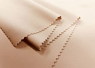 La chaîne en nylon de 82% a tricoté le tissu pour la couleur beige 200GSM de sous-vêtements extensible